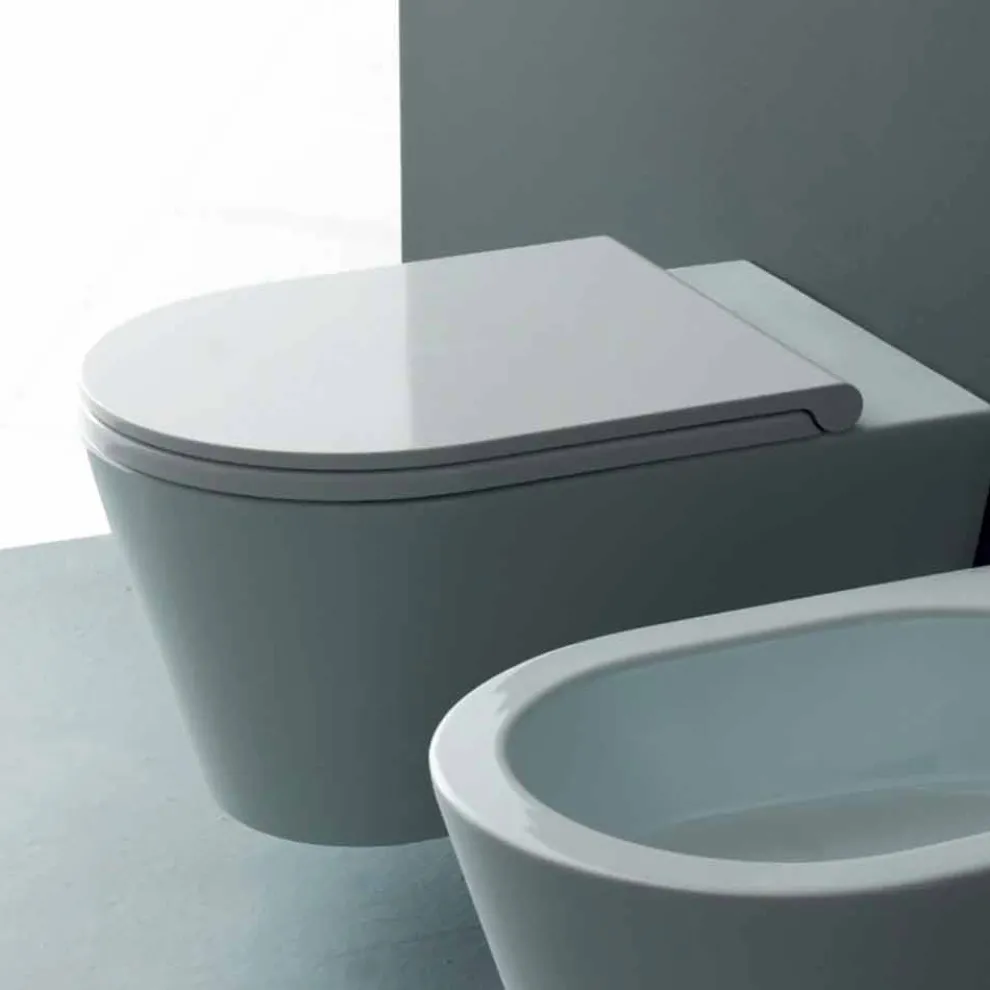 Moderne hängende Toilettenschüssel aus Keramik Sun Round 57x37 Italy
